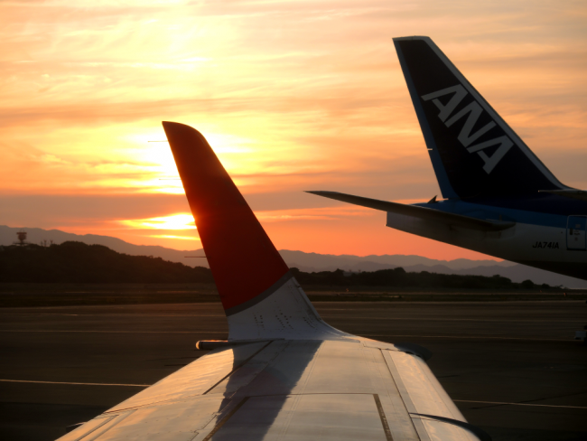 Airplane tails at sunset