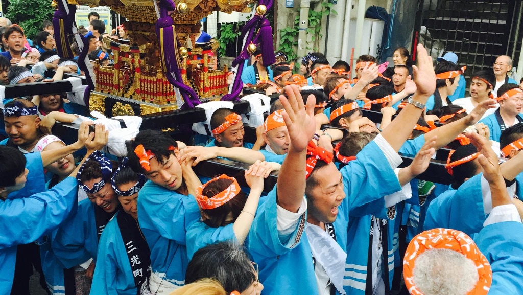 Matsuri revelers carry an omikoshi through the backstreets of Shinjuku for a summer matsuri Jon DeHart