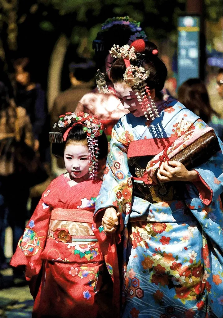 Geisha with a child wearing colourful kimono