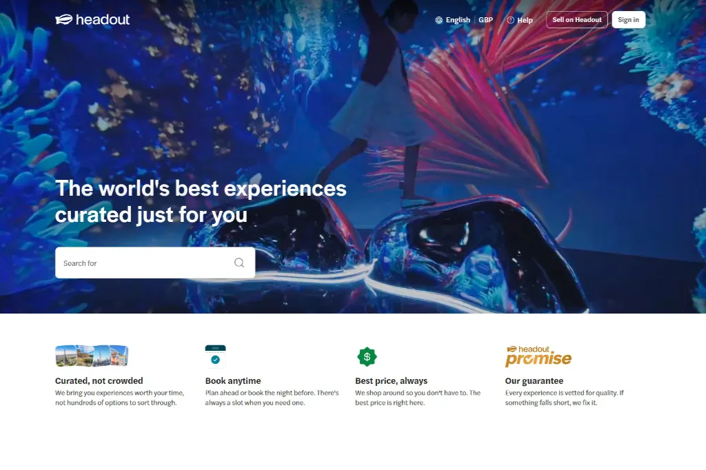 Screenshot of the Headout website homepage featuring the tagline "The world's best experiences curated just for you," highlighting search functionality and platform guarantees such as curated listings, anytime booking, and best price assurances.